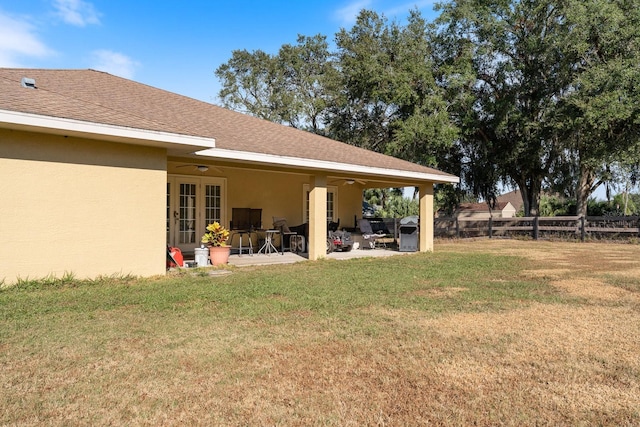 view of yard with a patio area and ceiling fan