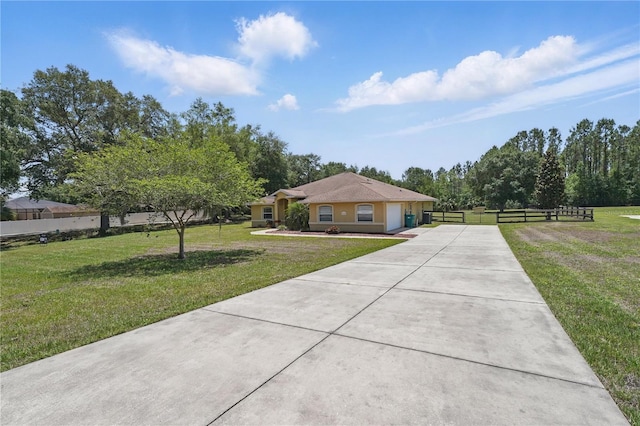 4995 County Road 121d, Wildwood, FL 34785 - ranch-style house with driveway and an attached garage