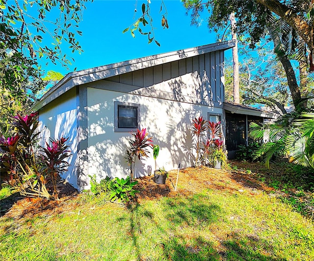 view of home's exterior featuring a lawn