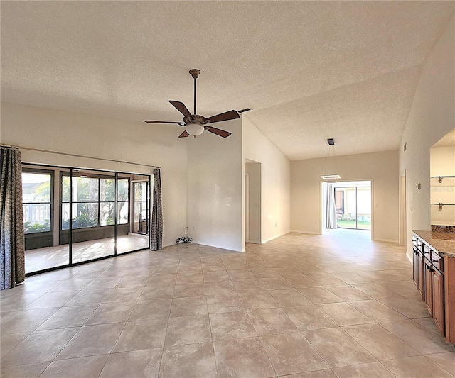 unfurnished room with ceiling fan, light tile patterned floors, and a healthy amount of sunlight