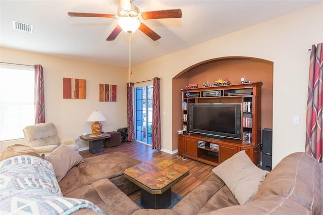 living room with hardwood / wood-style flooring and ceiling fan