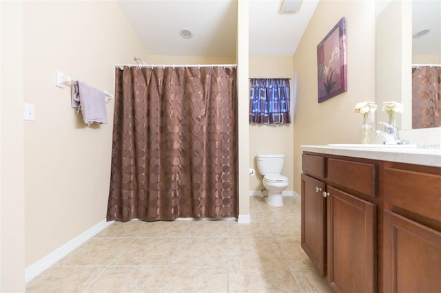 bathroom featuring tile patterned floors, vanity, and toilet