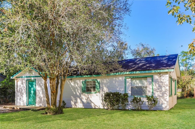 view of home's exterior featuring a yard