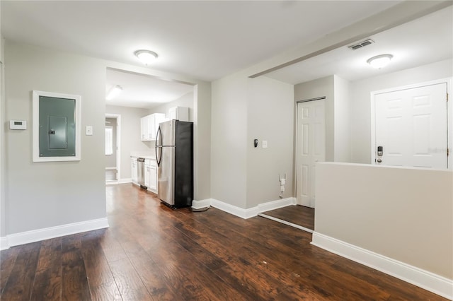 interior space featuring electric panel and dark wood-type flooring