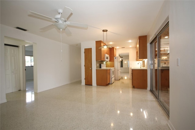 interior space with ceiling fan