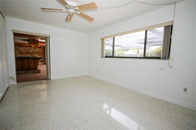 spare room with ceiling fan