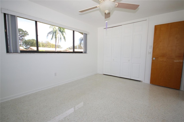 unfurnished bedroom featuring a closet and ceiling fan