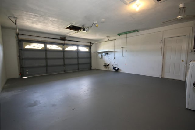 garage featuring a garage door opener and washer / clothes dryer