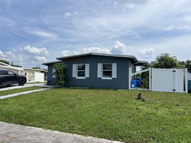 view of home's exterior with a lawn