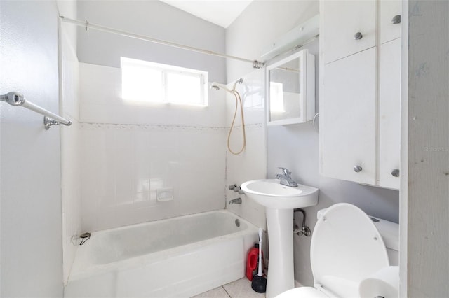 full bathroom with tile patterned flooring, sink, toilet, and tiled shower / bath