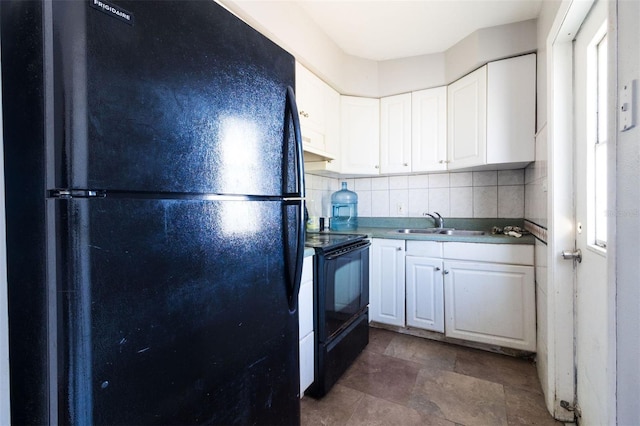 kitchen featuring backsplash, white cabinetry, sink, and black appliances