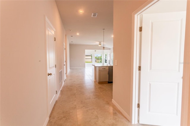 hall with light tile patterned flooring