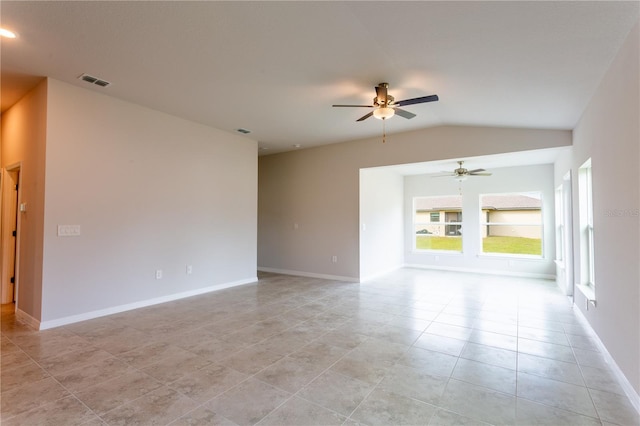447 Raymer St, Lehigh Acres, FL 33974 - spare room with ceiling fan, lofted ceiling, light tile patterned floors, and baseboards