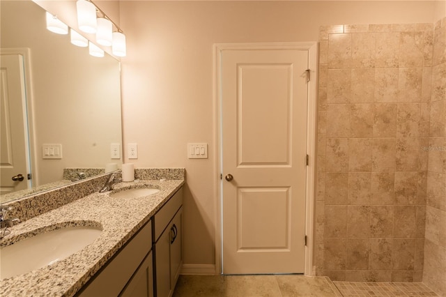 bathroom with tile patterned flooring and vanity