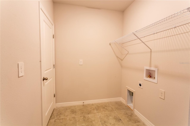 447 Raymer St, Lehigh Acres, FL 33974 - laundry area featuring electric dryer hookup, hookup for a washing machine, and baseboards