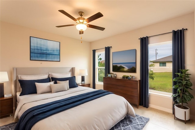 tiled bedroom with ceiling fan