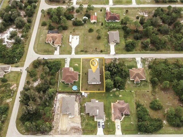 447 Raymer St, Lehigh Acres, FL 33974 - aerial view of property's location featuring property parcel outlined