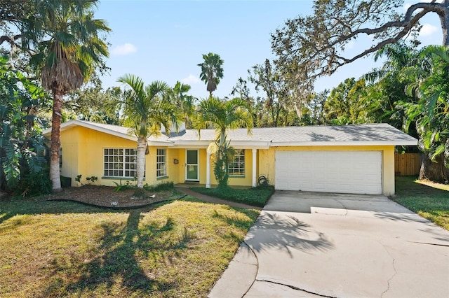 single story home with a garage and a front yard