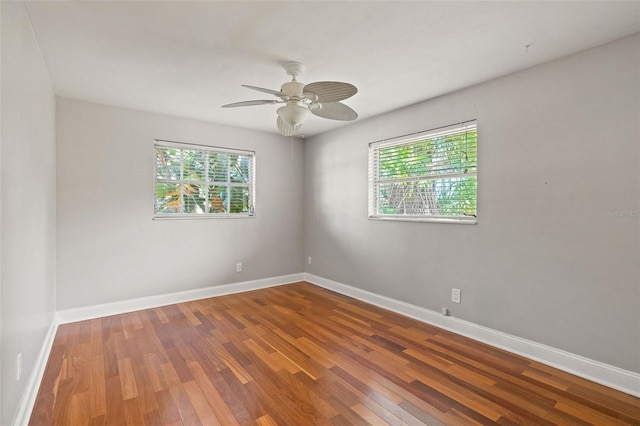 unfurnished room with ceiling fan and wood-type flooring