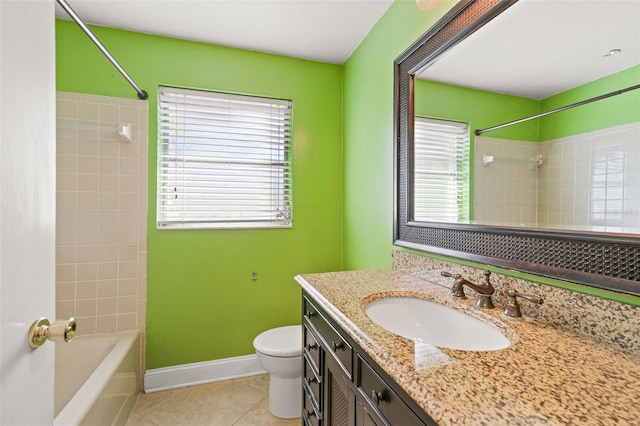 full bathroom featuring toilet, vanity, tile patterned floors, and tiled shower / bath