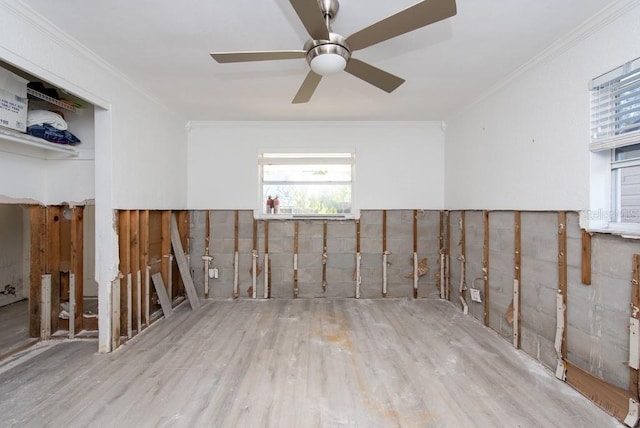 unfurnished room with ceiling fan, ornamental molding, and light hardwood / wood-style flooring