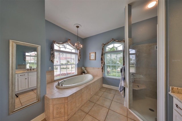 bathroom featuring independent shower and bath, lofted ceiling, a chandelier, tile patterned flooring, and vanity