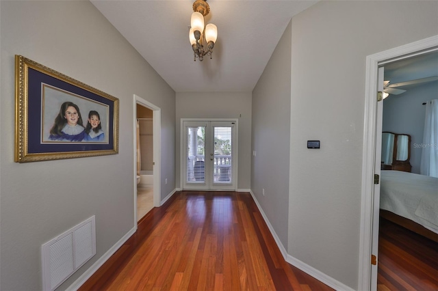 entryway featuring wood-type flooring and french doors