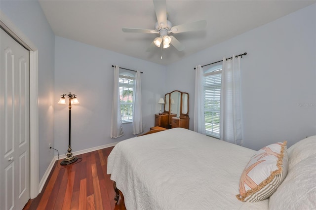 bedroom featuring ceiling fan and dark hardwood / wood-style floors