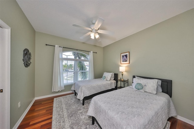 bedroom featuring ceiling fan and dark hardwood / wood-style floors