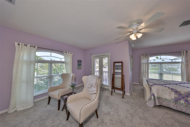 bedroom featuring ceiling fan and light carpet