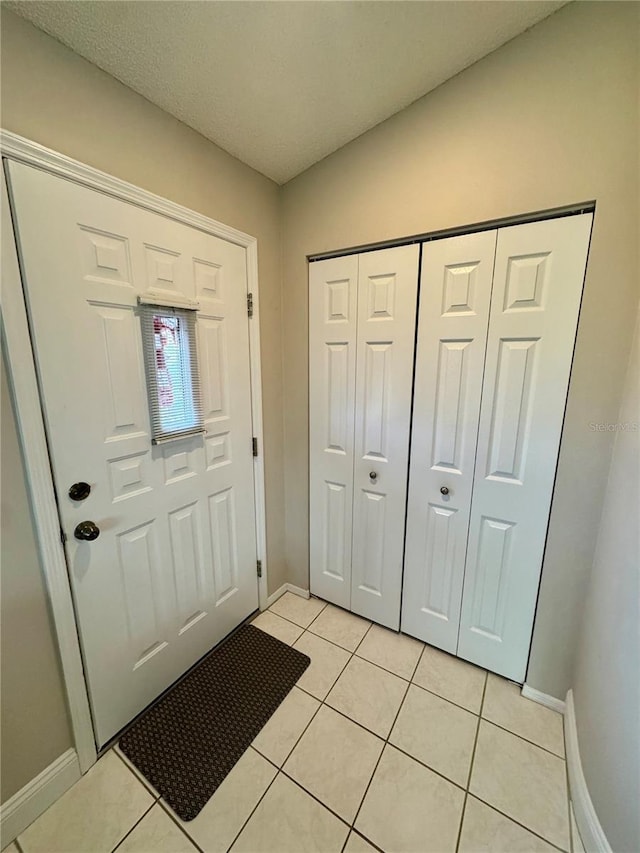 view of tiled foyer entrance