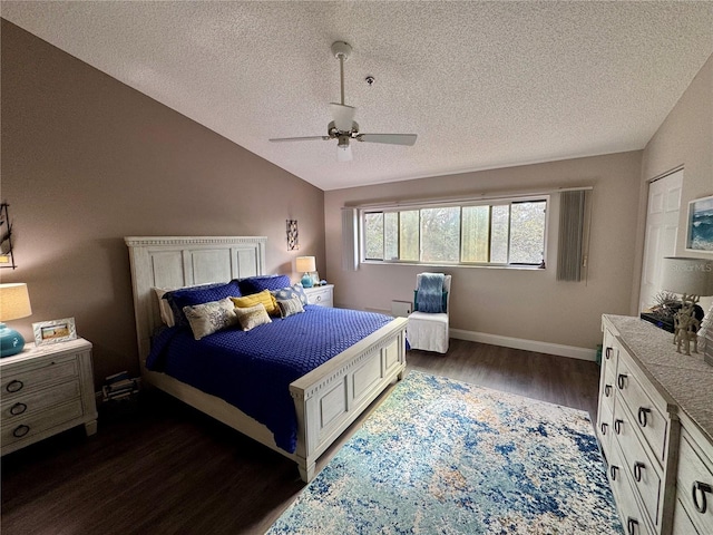 bedroom with ceiling fan, lofted ceiling, a textured ceiling, and dark hardwood / wood-style flooring