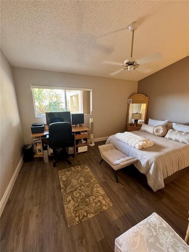 bedroom featuring ceiling fan, lofted ceiling, dark hardwood / wood-style flooring, and a textured ceiling