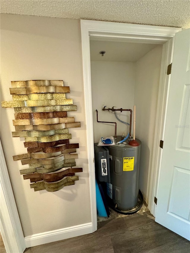 utility room featuring water heater