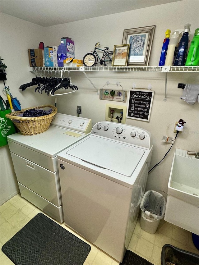 laundry area with sink and independent washer and dryer