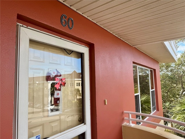 entrance to property featuring a balcony