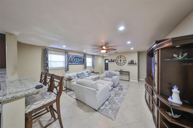 tiled living room featuring ceiling fan