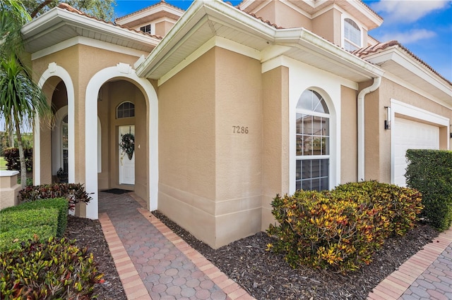 doorway to property featuring a garage