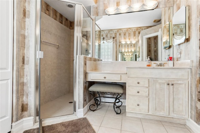 bathroom with tile patterned flooring, vanity, and a shower with door