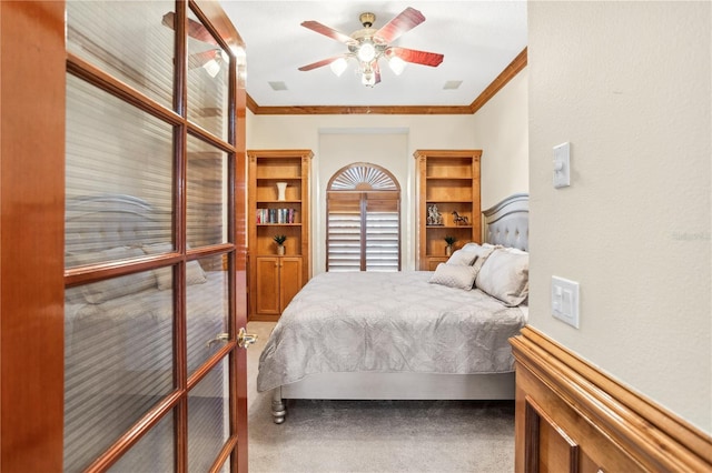 bedroom featuring carpet, ceiling fan, and ornamental molding