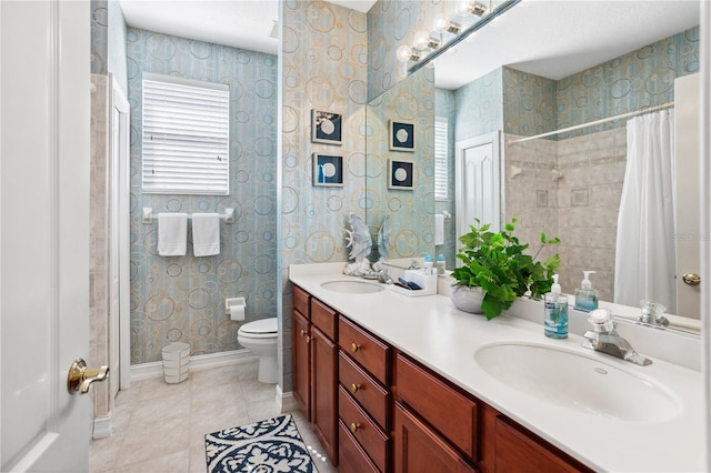 bathroom featuring tile patterned flooring, vanity, and toilet