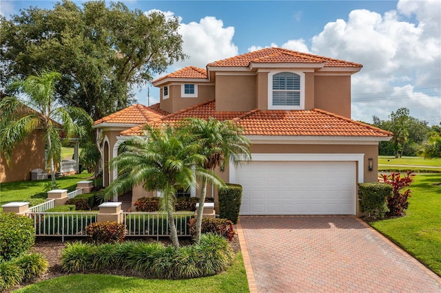 mediterranean / spanish-style home featuring a garage