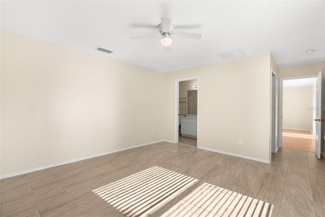 unfurnished bedroom featuring ensuite bathroom and ceiling fan