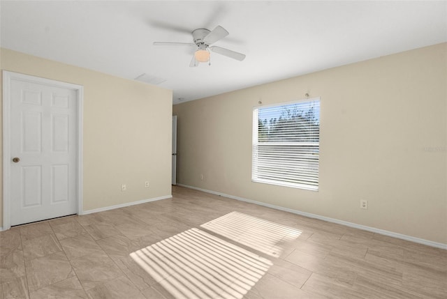 unfurnished bedroom featuring ceiling fan