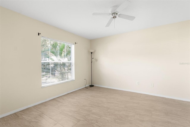 spare room with ceiling fan