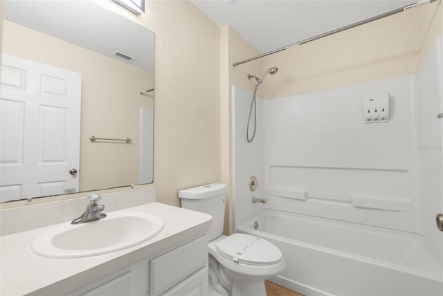 full bathroom featuring bathing tub / shower combination, vanity, and toilet