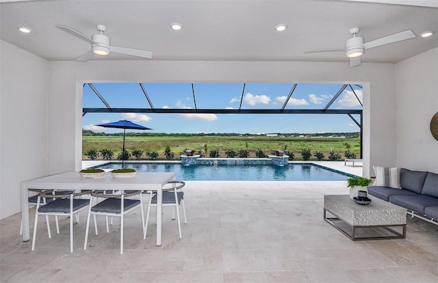 view of swimming pool featuring pool water feature and ceiling fan