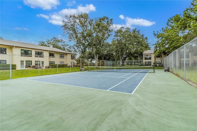 view of tennis court featuring basketball court