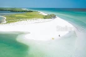 property view of water featuring a beach view