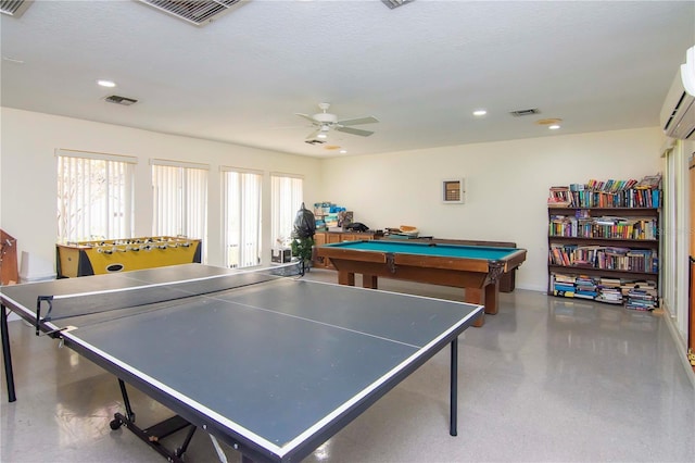 game room with a wall mounted AC, a textured ceiling, ceiling fan, and billiards